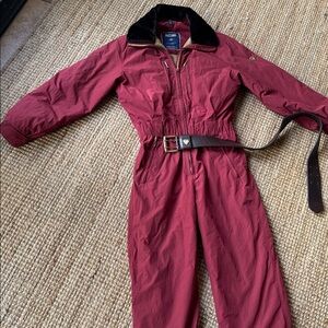 Red Jumpsuit with Belt there is a small hole on back 1/4 in POSTCARD